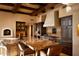 Large kitchen with granite island and wooden cabinetry at 10040 E Happy Valley Rd # 504, Scottsdale, AZ 85255