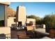 Outdoor patio with fireplace and seating area, mountain views at 10040 E Happy Valley Rd # 504, Scottsdale, AZ 85255