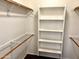 Walk-in closet with shelves and hanging rods at 1445 E Broadway Rd # 120, Tempe, AZ 85282