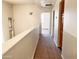 Upstairs hallway with carpet and access to bedrooms at 1445 E Broadway Rd # 120, Tempe, AZ 85282