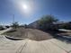 Single-story home with desert landscaping and a two-car garage at 24569 W Whyman Ave, Buckeye, AZ 85326
