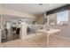 Bright kitchen with a breakfast nook and views into the living room at 25714 N 70Th Ln, Peoria, AZ 85383
