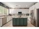 Modern kitchen with stainless steel appliances and a large island at 25714 N 70Th Ln, Peoria, AZ 85383