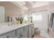 Clean bathroom with double vanity and shower at 25714 N 70Th Ln, Peoria, AZ 85383