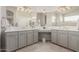 Elegant bathroom with dual vanities and a large mirror at 25714 N 70Th Ln, Peoria, AZ 85383