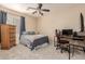 Comfortable bedroom with built-in desk and plenty of storage at 25714 N 70Th Ln, Peoria, AZ 85383