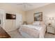 Bedroom with a queen bed and window at 25714 N 70Th Ln, Peoria, AZ 85383