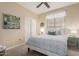 Bedroom with a queen bed and artwork at 25714 N 70Th Ln, Peoria, AZ 85383