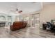 Spacious living room with a fireplace and sliding door at 25714 N 70Th Ln, Peoria, AZ 85383