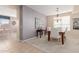 Elegant dining room with hardwood floors and purple accent wall at 25714 N 70Th Ln, Peoria, AZ 85383