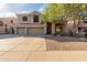 Two-story house with three-car garage and driveway at 25714 N 70Th Ln, Peoria, AZ 85383