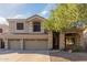 Two-story house with three-car garage and landscaping at 25714 N 70Th Ln, Peoria, AZ 85383