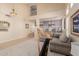 Bright living room with high ceilings, neutral decor and view of dining area at 25714 N 70Th Ln, Peoria, AZ 85383