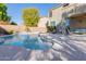 Relaxing pool area with patio furniture and landscaping at 25714 N 70Th Ln, Peoria, AZ 85383