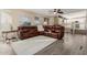 Spacious living room featuring a large sectional sofa and hardwood floors at 25714 N 70Th Ln, Peoria, AZ 85383