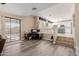 Open living room with a view of the kitchen and stairs at 25714 N 70Th Ln, Peoria, AZ 85383