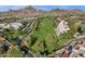 Aerial view of community near mountains, golf course, and city skyline at 2626 E Arizona Biltmore Cir # 40, Phoenix, AZ 85016