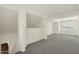 Open loft space showcasing high ceilings and a gray carpet at 2626 E Arizona Biltmore Cir # 40, Phoenix, AZ 85016