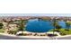 Aerial view of the community lake and surrounding homes at 39995 W Bravo Dr, Maricopa, AZ 85138