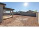 Large backyard with a covered patio and block wall at 39995 W Bravo Dr, Maricopa, AZ 85138