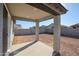 Covered patio provides shade in this spacious backyard at 39995 W Bravo Dr, Maricopa, AZ 85138