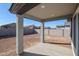 Covered patio overlooks a large backyard with block wall at 39995 W Bravo Dr, Maricopa, AZ 85138