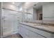 Modern bathroom with double sinks and a shower at 39995 W Bravo Dr, Maricopa, AZ 85138