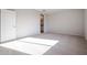 Bright bedroom with carpet flooring and bathroom access at 39995 W Bravo Dr, Maricopa, AZ 85138