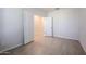 Simple bedroom with light gray walls and neutral carpeting at 39995 W Bravo Dr, Maricopa, AZ 85138