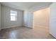 Simple bedroom with light gray walls and neutral carpeting at 39995 W Bravo Dr, Maricopa, AZ 85138