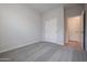 Spacious bedroom with carpet floors and a double door closet at 39995 W Bravo Dr, Maricopa, AZ 85138