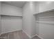 Spacious walk-in closet with double hanging rods and shelving at 39995 W Bravo Dr, Maricopa, AZ 85138