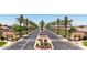 The Lakes at Rancho El Dorado community entrance with palm trees at 39995 W Bravo Dr, Maricopa, AZ 85138