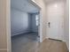 Bright entryway with light flooring and a view into an adjacent room at 39995 W Bravo Dr, Maricopa, AZ 85138