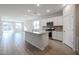 Open concept kitchen with island and stainless steel appliances at 39995 W Bravo Dr, Maricopa, AZ 85138