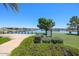 Peaceful lake view with a walking path and green space at 39995 W Bravo Dr, Maricopa, AZ 85138