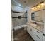 Modern bathroom with a walk-in shower, white vanity and granite countertop at 4237 E 4Th Ave, Apache Junction, AZ 85119