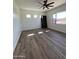 Well-lit bedroom with wood-look flooring and multiple windows at 4237 E 4Th Ave, Apache Junction, AZ 85119