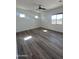 Large bedroom with wood flooring and multiple windows at 4237 E 4Th Ave, Apache Junction, AZ 85119