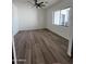 Spacious bedroom with large window and wood-look flooring at 4237 E 4Th Ave, Apache Junction, AZ 85119