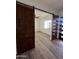 Bedroom with barn door entry and wood-look flooring at 4237 E 4Th Ave, Apache Junction, AZ 85119