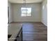 Bright dining room features hardwood floors and a modern light fixture at 4237 E 4Th Ave, Apache Junction, AZ 85119