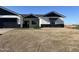 Modern home with a two-car garage and landscaped yard at 4237 E 4Th Ave, Apache Junction, AZ 85119