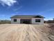 Rear view of a single story home with a modern design at 4237 E 4Th Ave, Apache Junction, AZ 85119