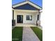 Covered patio with modern door and stone accents at 4237 E 4Th Ave, Apache Junction, AZ 85119