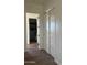 Bright hallway with wood-look flooring and access to bathroom and closet at 4237 E 4Th Ave, Apache Junction, AZ 85119