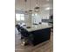 Modern kitchen with a large island and white cabinets at 4237 E 4Th Ave, Apache Junction, AZ 85119
