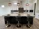 Modern kitchen with a large island and white cabinets at 4237 E 4Th Ave, Apache Junction, AZ 85119