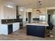 Modern kitchen with white cabinets, marble countertops, and gold accents at 4237 E 4Th Ave, Apache Junction, AZ 85119