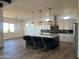 Open concept kitchen with island and stainless steel appliances at 4237 E 4Th Ave, Apache Junction, AZ 85119